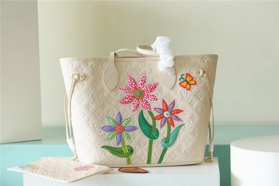 Il partito ha marcato a caldo le signore monogramma Empreinte di Neverfull millimetro della borsa con l'intarsiatura del fiore
