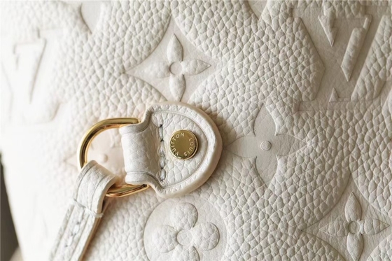 Il partito ha marcato a caldo le signore monogramma Empreinte di Neverfull millimetro della borsa con l'intarsiatura del fiore