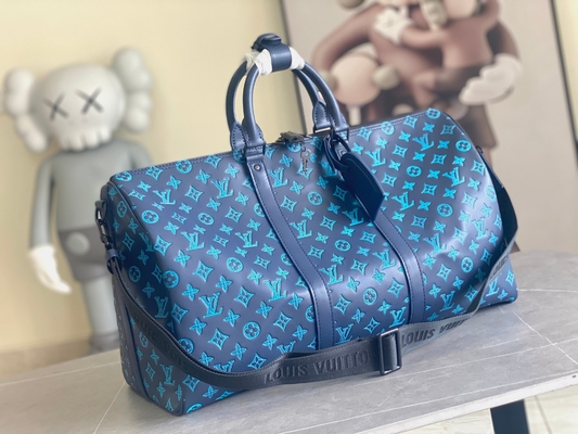 Borse blu di Keepall BANDOULIÈRE 50 Boston della borsa dei grandi uomini bollati