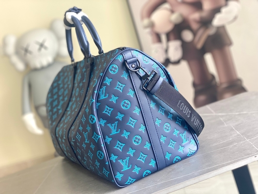 Borse blu di Keepall BANDOULIÈRE 50 Boston della borsa dei grandi uomini bollati