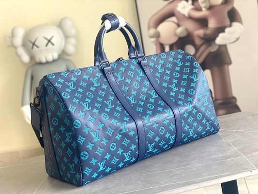 Borse blu di Keepall BANDOULIÈRE 50 Boston della borsa dei grandi uomini bollati