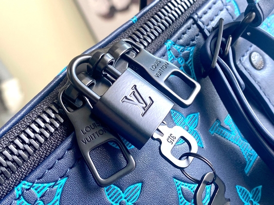 Borse blu di Keepall BANDOULIÈRE 50 Boston della borsa dei grandi uomini bollati