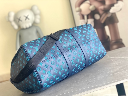 Borse blu di Keepall BANDOULIÈRE 50 Boston della borsa dei grandi uomini bollati