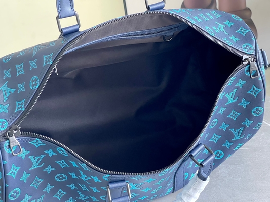 Borse blu di Keepall BANDOULIÈRE 50 Boston della borsa dei grandi uomini bollati